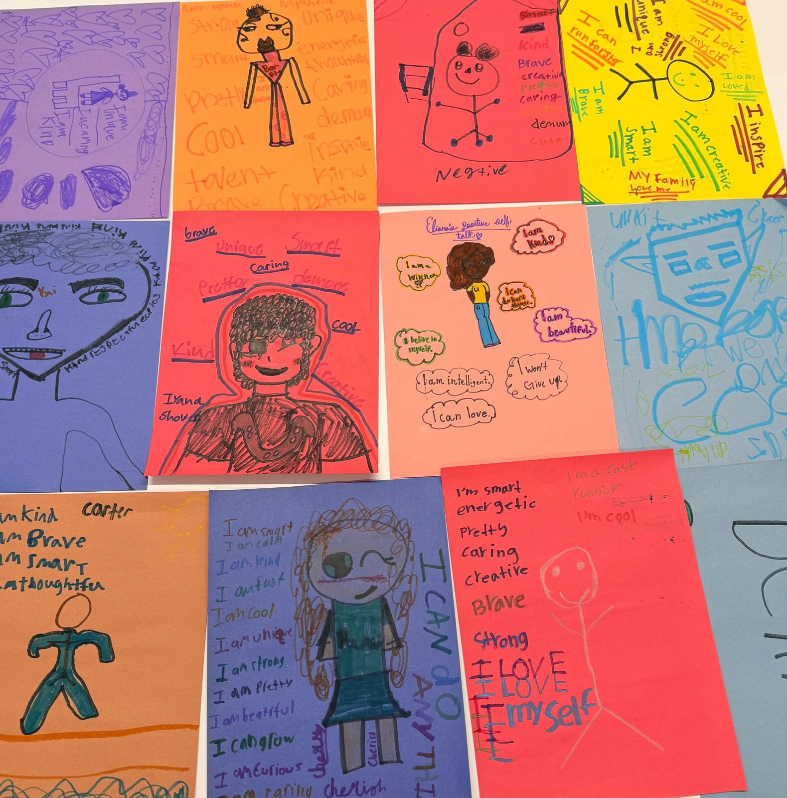 Student artwork with affirmations like I am kind, I am brave, and I can do anything